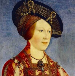 A portrait showcasing a young woman, believed to be Anna of Bohemia and Hungary, adorned with pearls and a jeweled headdress.